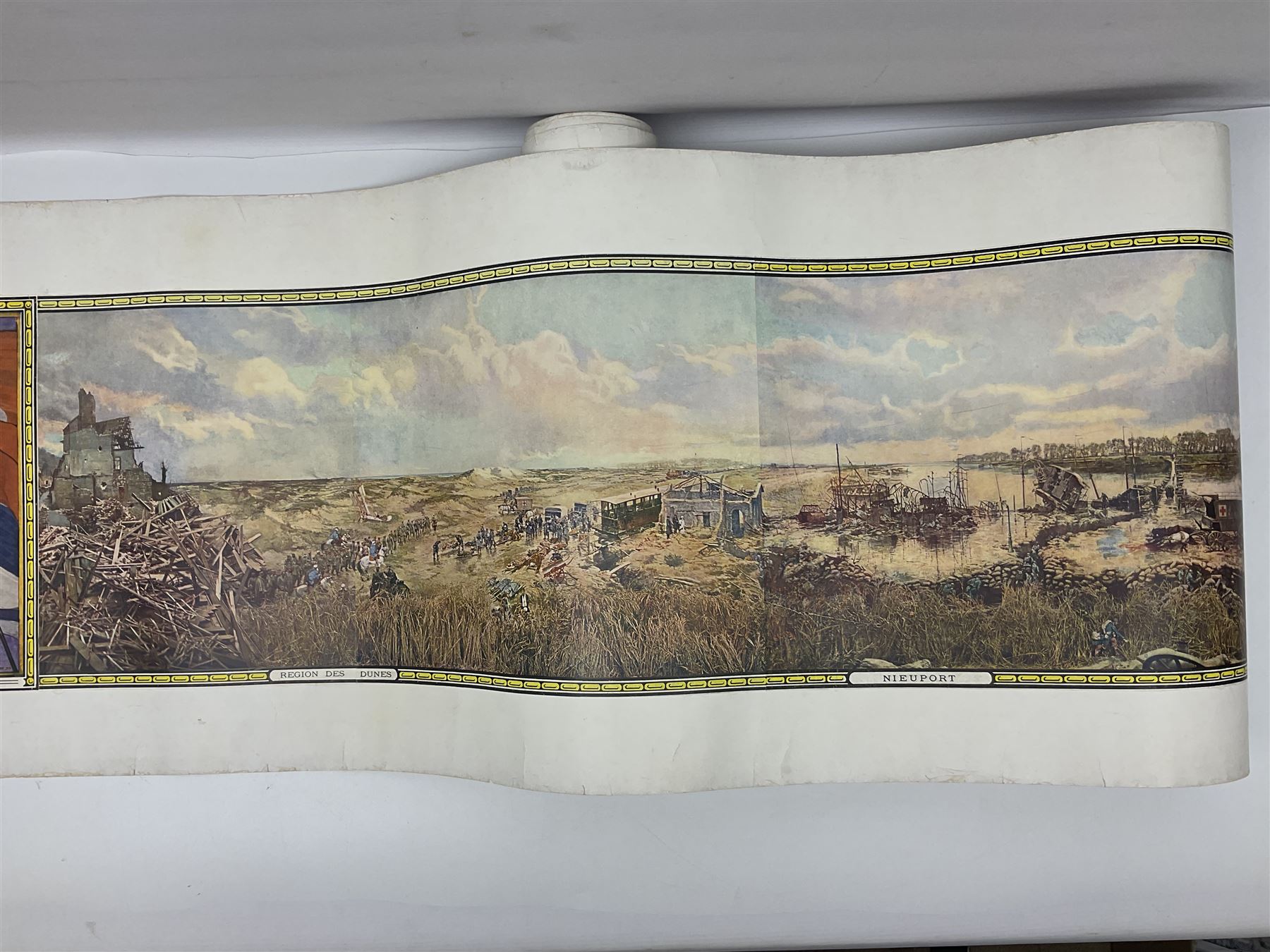 After A. Bastien, very long WW1 panoramic colour print entitled 'Panorama of the Battle of the Yser in 1914' depicting Ypres, Dixmude, Boucle de Tervaete, Nieuport (2) and region des Dunes, flanked by Flags of the Allies 45 x 337cm; unframed