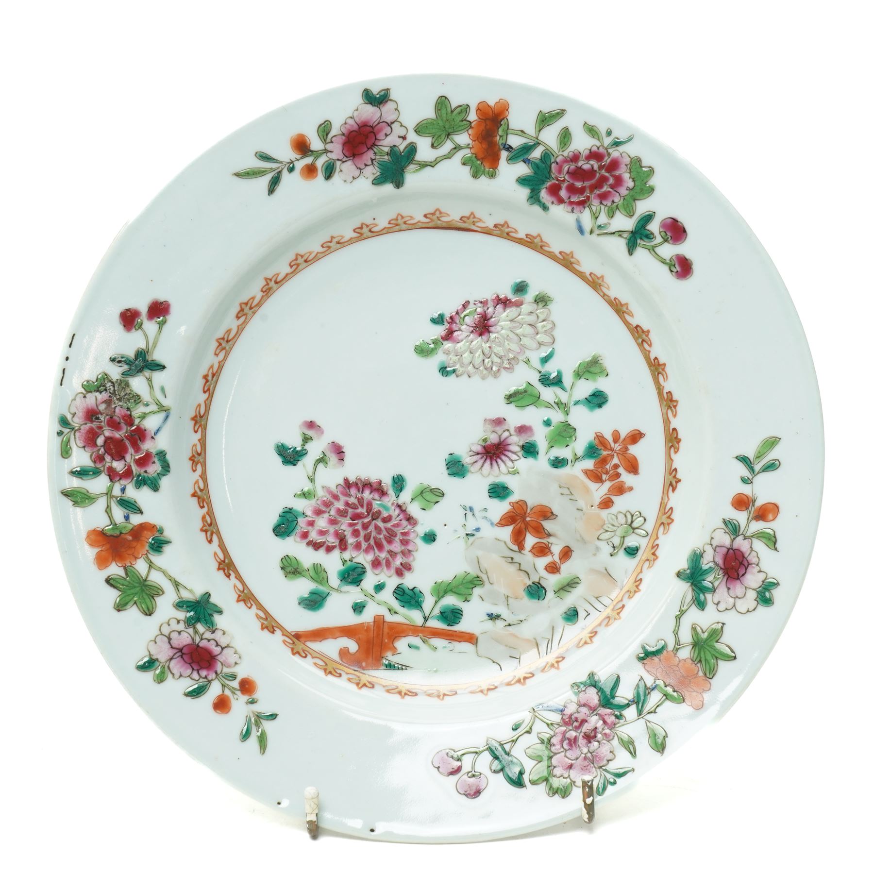 Pair of 18th century Chinese famille rose plates, painted profusely with flowers, D23cm; together with a Yixing teapot, painted with butterflies, H12cm (3)