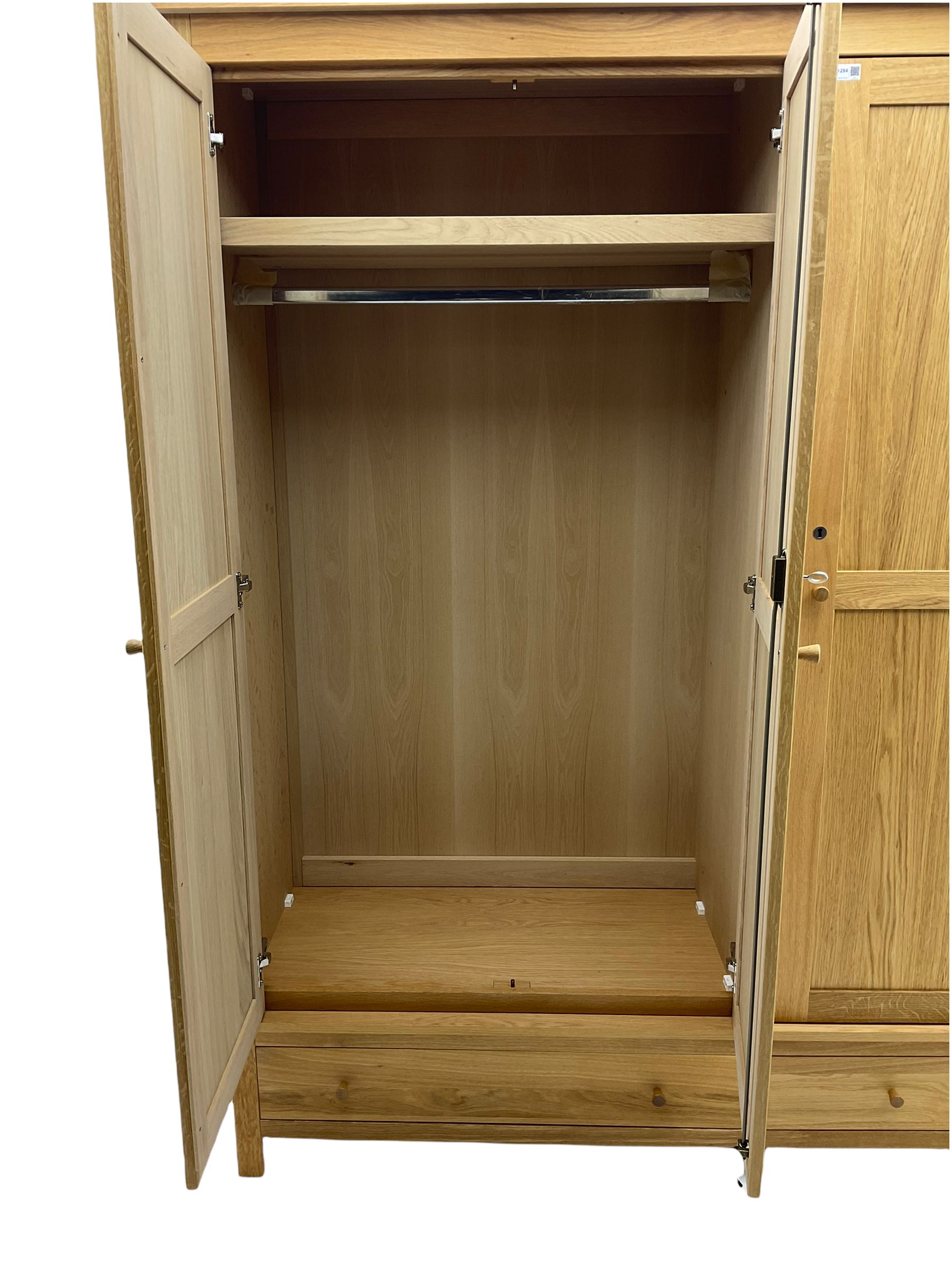 Corndell Furniture - light oak triple wardrobe, enclosed by three panelled doors, one long and one short drawer