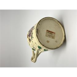 18th century creamware teapot, probably Leeds, with reeded entwined handle and floral finial to the cover, the body with hand painted polychrome decoration of figure to one side, and floral spray to the other, collectors paper label beneath inscribed Leeds Pottery, H11.5cm