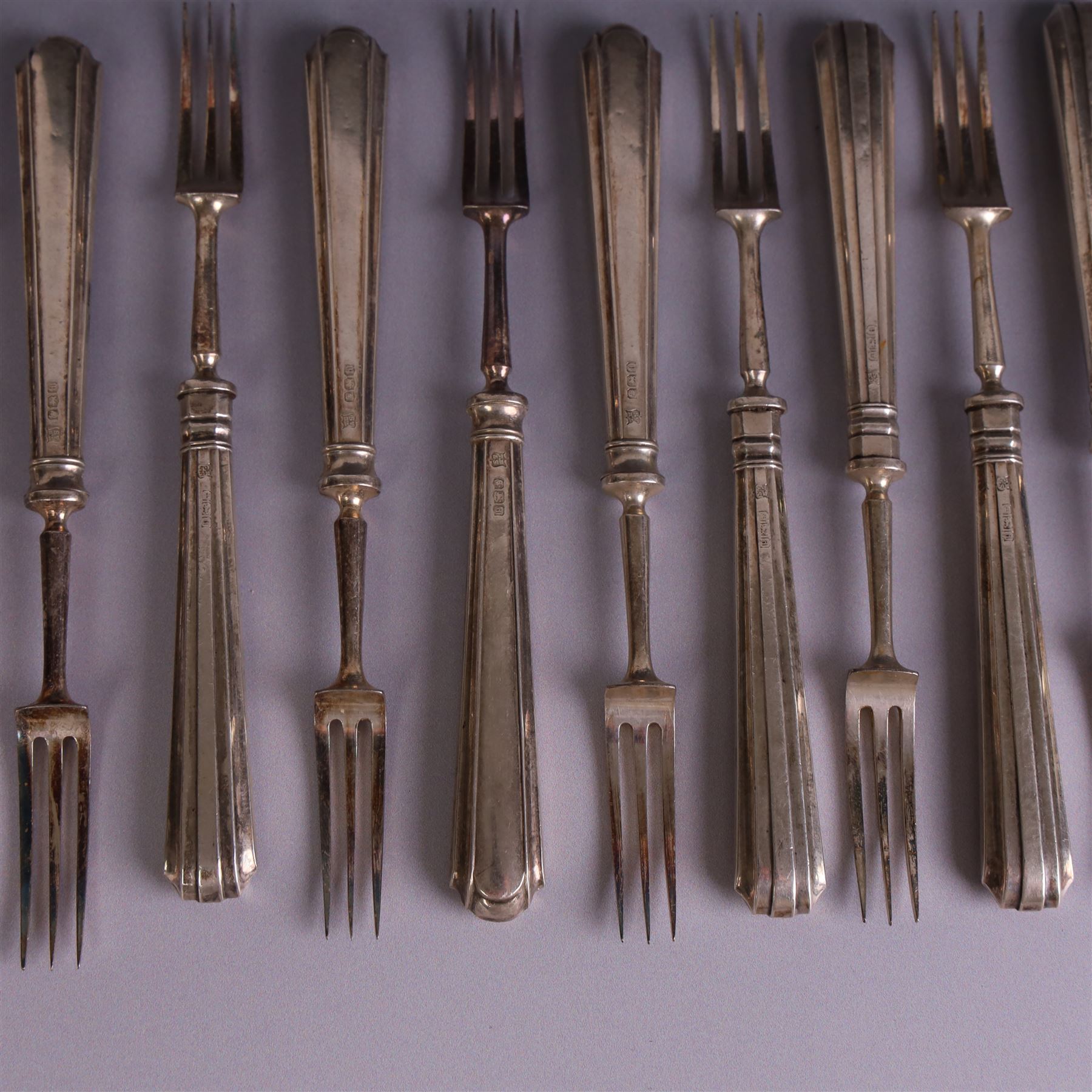 Set of twelve 1920s silver handled dessert knives and forks, hallmarked Thomas Bradbury & Sons Ltd, Sheffield 1921