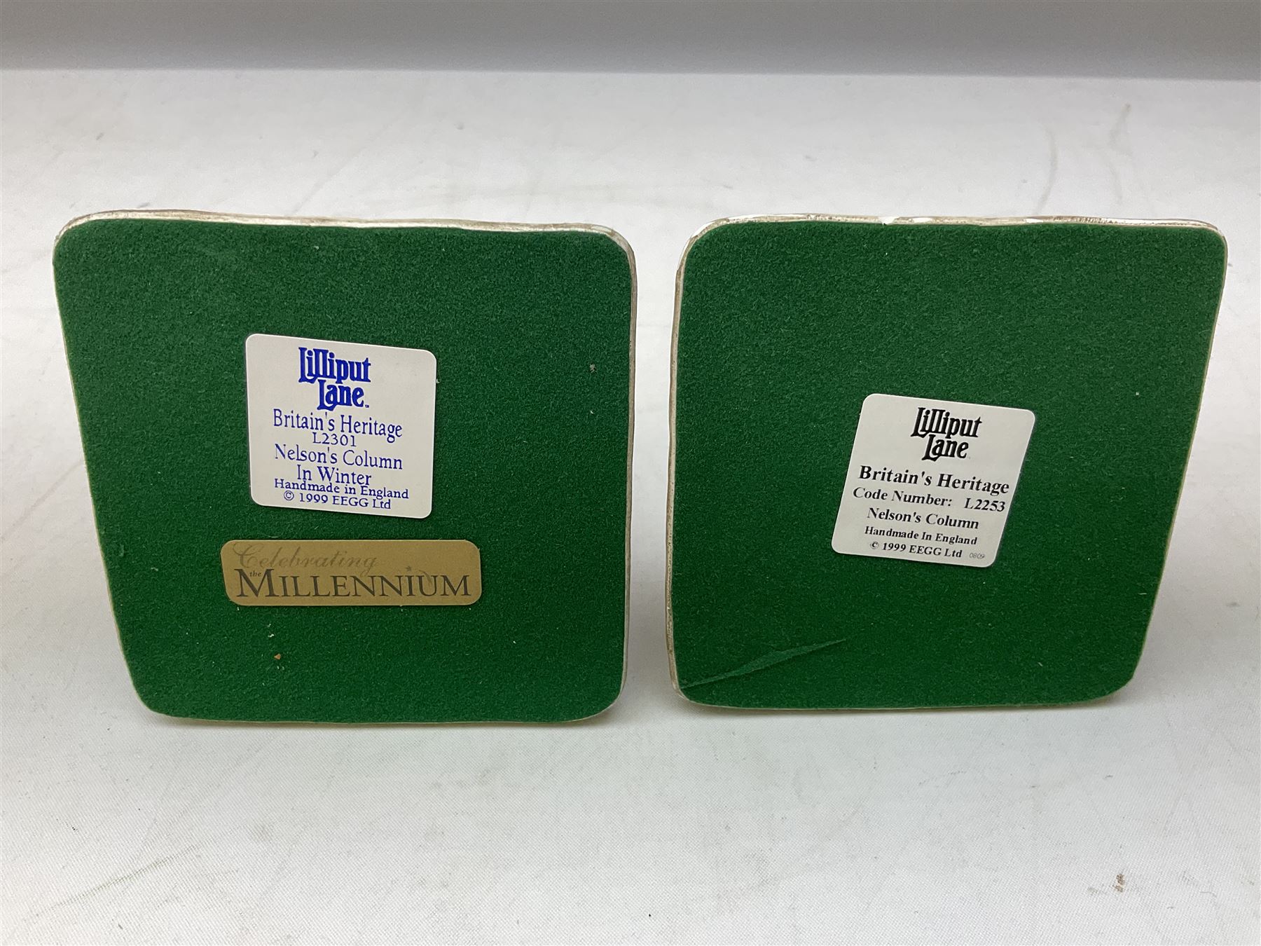 Five Lilliput Lane models from the 'Britain's Heritage' collection, comprising The Royal Albert Hall, Windsor Castle Round Tower, Eros and Nelson's Column and another snowed, all boxed