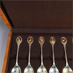 Royal Society for The Protection of Birds silver spoon collection, twelve spoons each inset with a silver-gilt bird cameo, hallmarked John Pinches Ltd, London 1975, in wooden presentation case with certificate of authenticity
