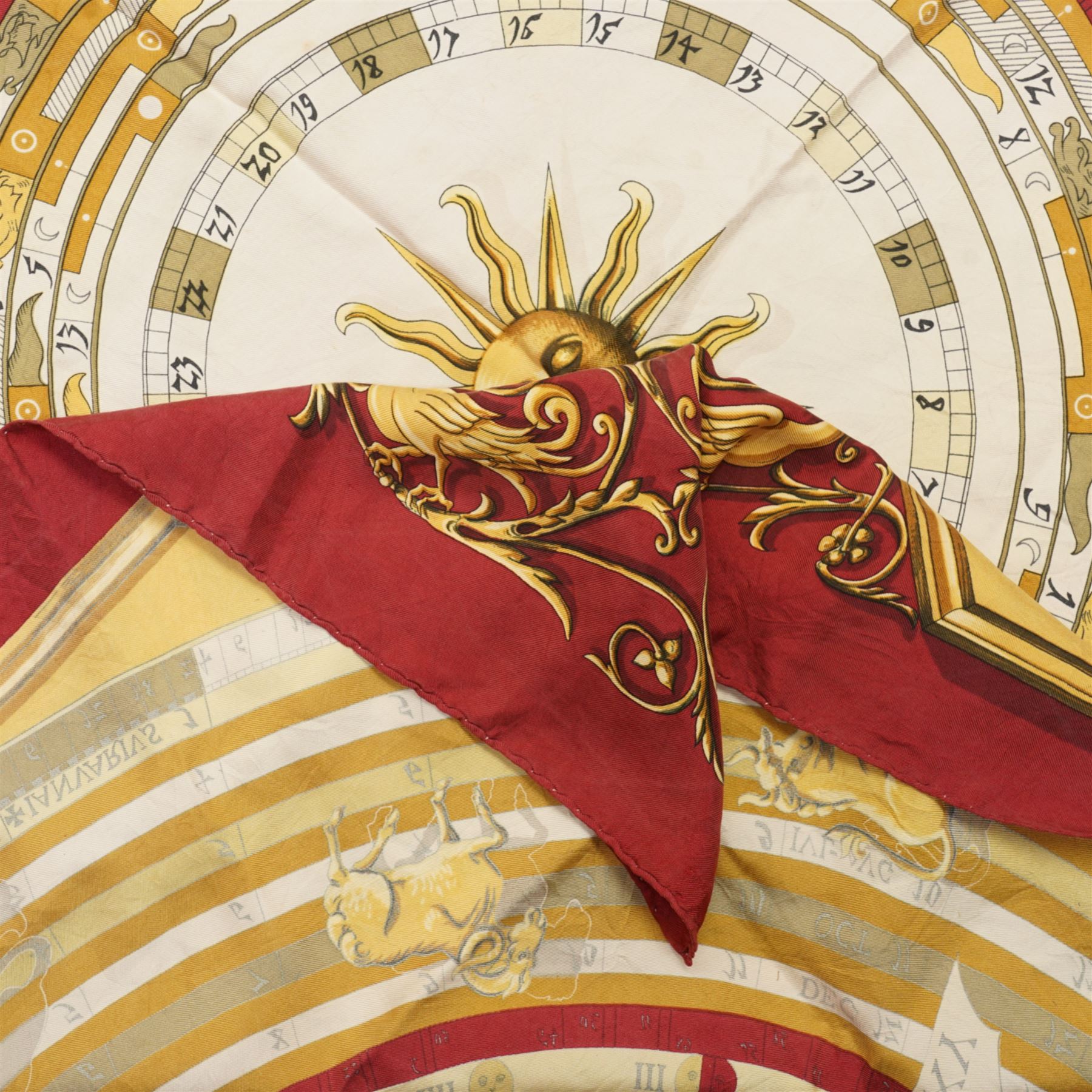 Hermes 'Astrologie' or 'Dies et Hore' silk scarf, in red and gold colourway, designed by Francoise Faconnet, 86cm x 86cm