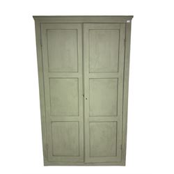 Painted pine cupboard, two panelled doors enclosing four shelves, in laurel green finish