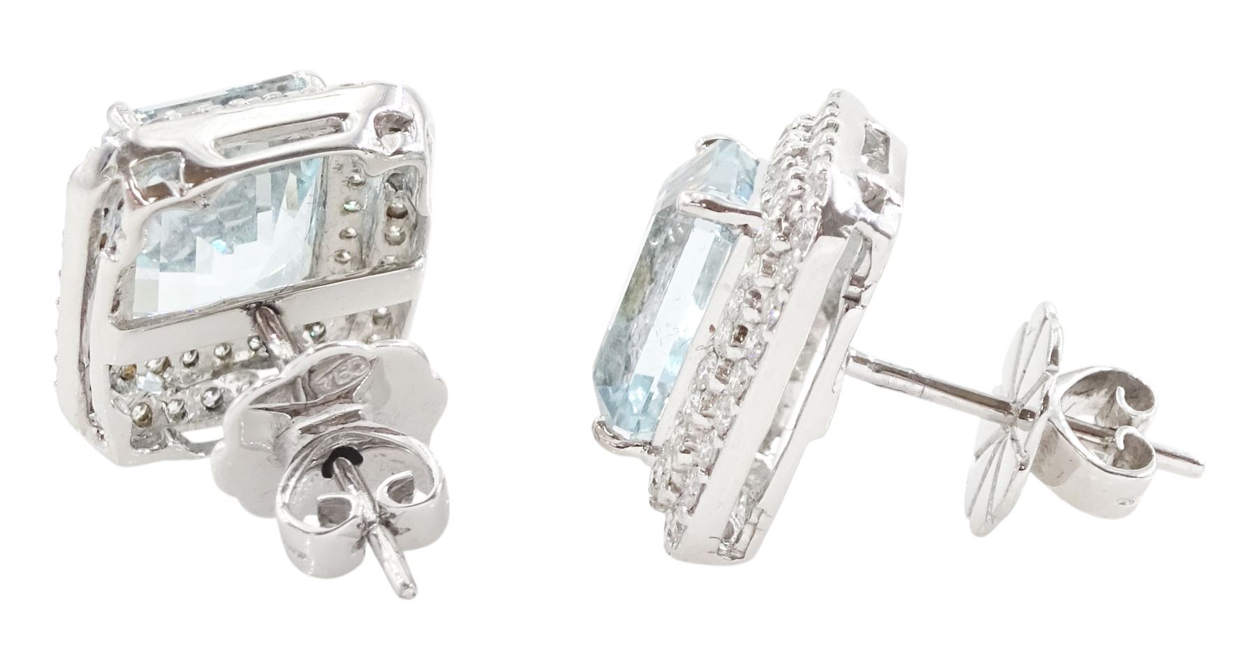 Pair of 18ct white gold aquamarine and diamond cluster earrings, each stud set with a single octagonal cut aquamarine and two rows of round brilliant cut diamonds, total aquamarine weight approx 6.30 carat, total diamond weight approx 1.00 carat