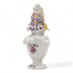 Longton Hall floral table ornament, circa 1755, the moulded rococo base painted with floral sprays and sprigs, below a floral encrusted arrangement, unmarked, H14.5cm 