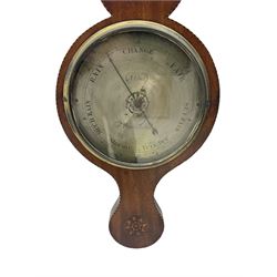 An early 19th century William IV mercury wheel barometer with a rosette inlaid broken pediment and correspondingly inlaid round base, mahogany veneered case with inlaid oval conch shell paterae and satinwood stringing to the edge, with a spirit thermometer, silvered 8” register with weather predictions and steel indicating hand, flat glass with a cast brass bezel, dial inscribed “Abbot, Warranted”