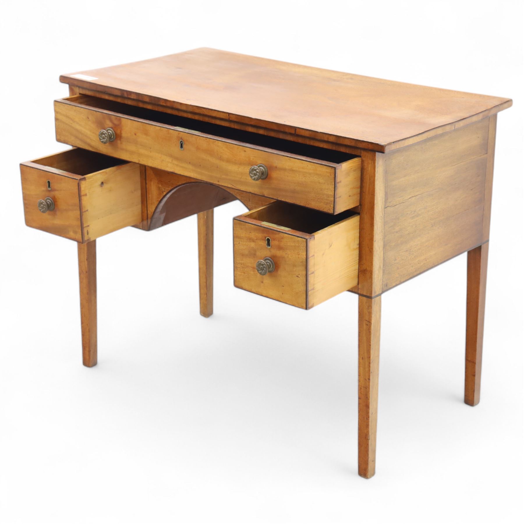 Early 19th-century mahogany kneehole desk with ebony stringing, rectangular top above an arrangement of one long and four short drawers, each with brass knob handles, raised on square tapered legs