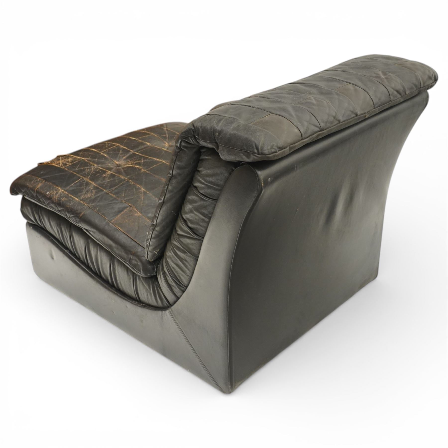 Mid 20th century leather upholstered two-piece sectional sofa with footstool, buttoned back cushions with stitched panel decoration, padded armrests and deep seat cushions, raised on concealed supports