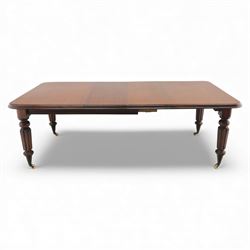 Large Victorian mahogany dining table, rectangular telescopic top with two additional leaves, upon turned knopped and reeded legs with ceramic casters, (Extends to 230cm)