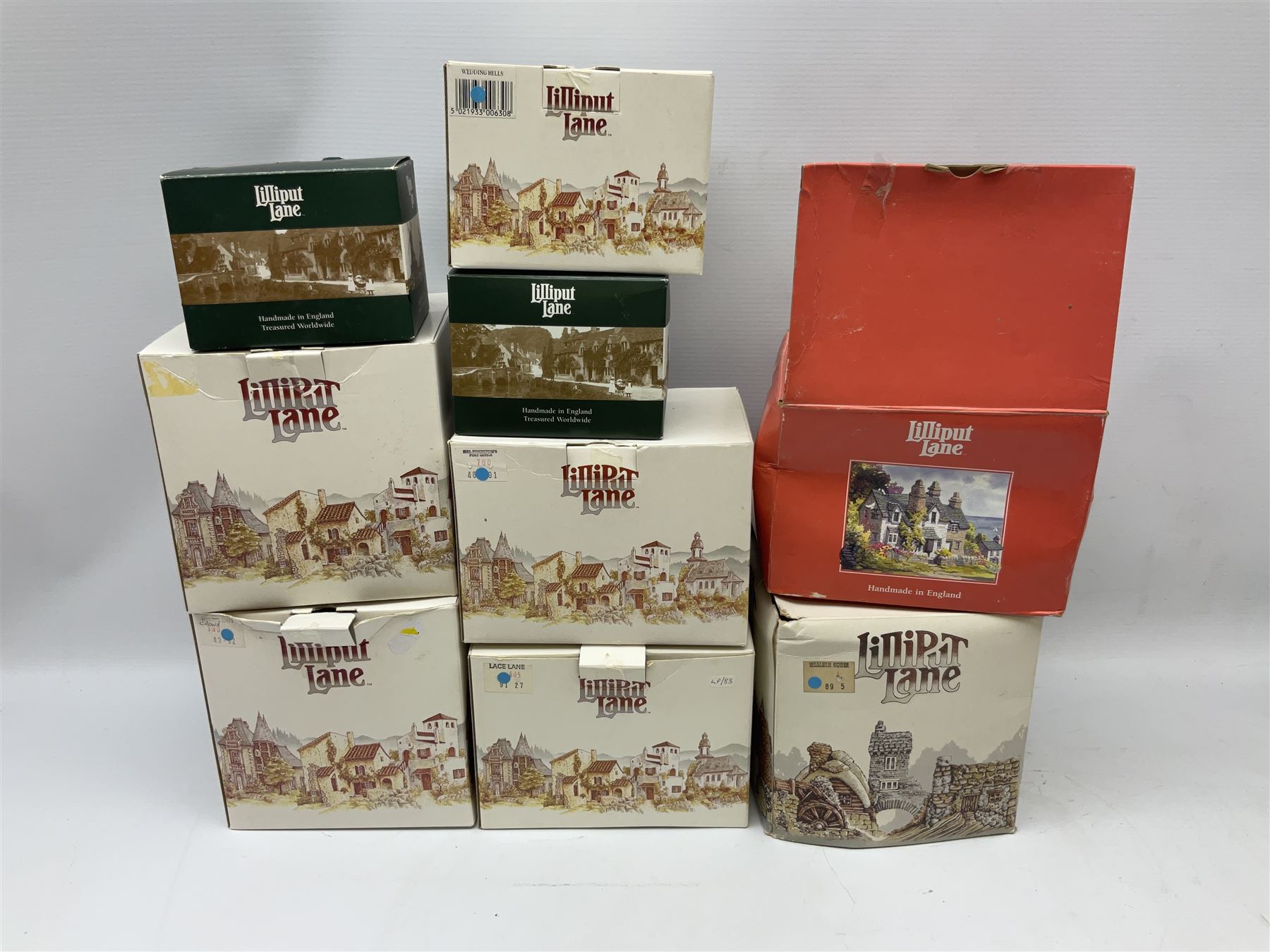 Nine Lilliput Lane cottages from the British and English collections to include Crown Inn, Wealden House, Puffin Row, etc, all boxed, one without deeds