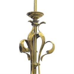 20th century Art Nouveau brass wall light, vertical stem with three scrolling arms terminating in lamp holders, central baluster element with curving supports