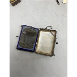 George V silver evening purse, the body of rectangular form with engraved decoration of swags and suspension chain, hallmarked G & C Ltd Birmingham 1918, together with Art Deco black beaded ladies bag (a/f), pair of hallmarked silver cufflinks, hallmarked silver bow brooch, 19th century portable inkwell, Victorian padlock stamped with the crown VR, etc