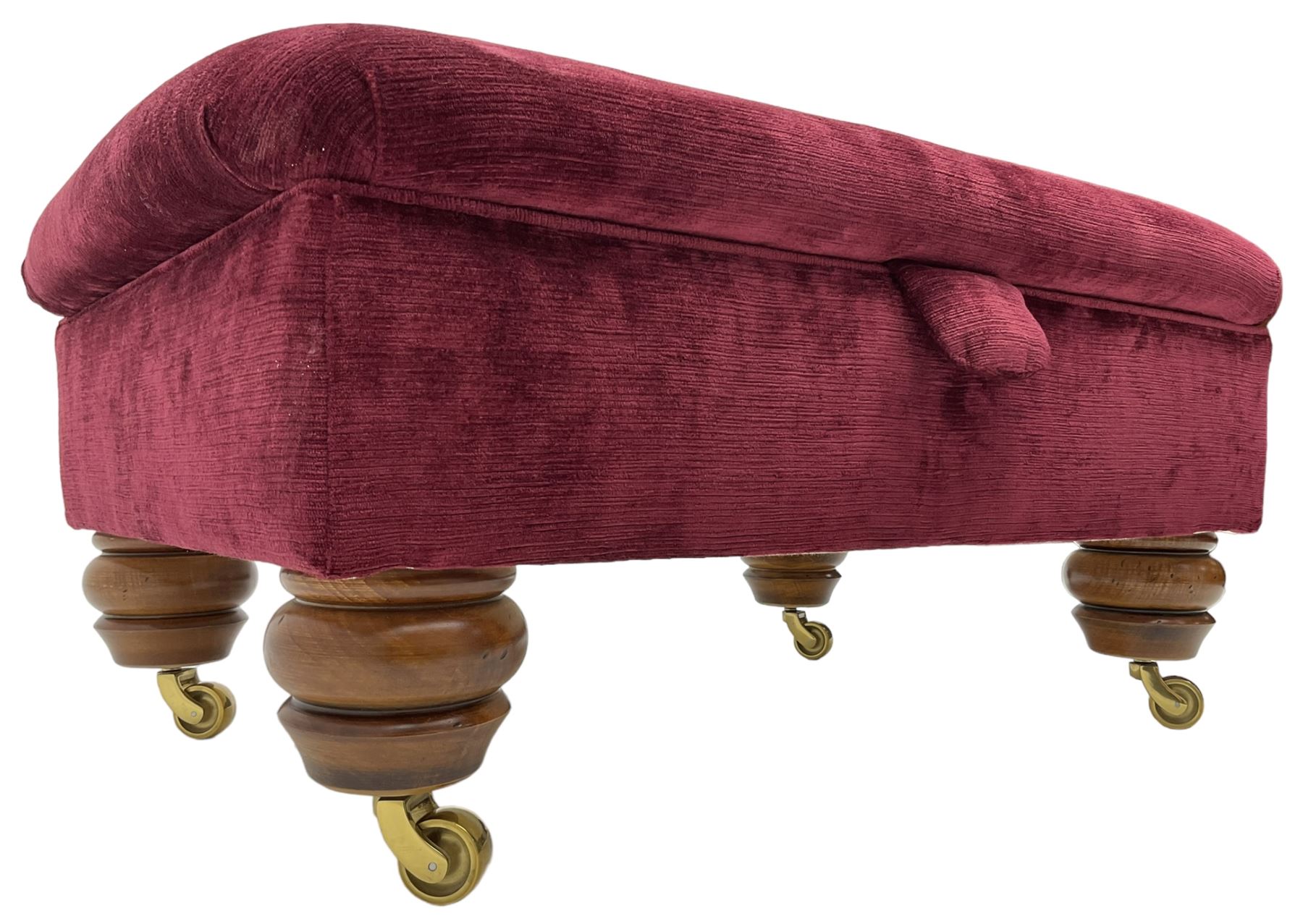 Duresta - traditional shape armchair upholstered in burgundy red velvet, on square tapering front supports (W88cm, H85cm, D103cm); together with a matching rectangular footstool with hinged seat, on turned feet with brass castors (73cm x 54cm, H38cm)
