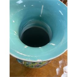 19th century Chinese famille rose yellow ground porcelain vase, of baluster form with twin applied mask ring handles, the body decorated with two shaped reserves mounted with dragon heads, depicting warriors at battle and at court, the neck with two smaller conforming figural reserves, upon a yellow ground decorated with exotic birds amidst scrolling blossom, H45.cm