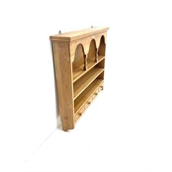 Pine three tier wall rack, projecting cornice, three shelves and four drawers 