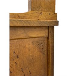 Yorkshire Oak 'Kingpost' - oak dresser, raised two heights plate rack, the base with rectangular adzed top over three drawers, central double cupboard and flanking single cupboards, enclosed by panelled doors, the plate rack and base each carved with kingpost signature, by Robert Ingham, Burton Leonard, Harrogate