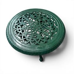 Painted cast iron garden table, the circular pierced top with foliate decoration and egg-and-dart rim, raised on three cloven hoof supports with classical female mask knees, united by pierced undertier, in green-painted finish