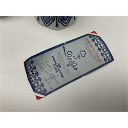 De Porceleyne Fles Delftware blue and white covered jar, of fluted baluster form, with floral and insect decoration, upon an octagonal foot, the octagonal cover with urn shaped finial, H32cm