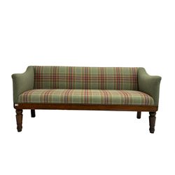 Late 19th century oak framed bench seat, upholstered in green and red tartan fabric, shaped arms over straight apron, raised on turned tapering supports