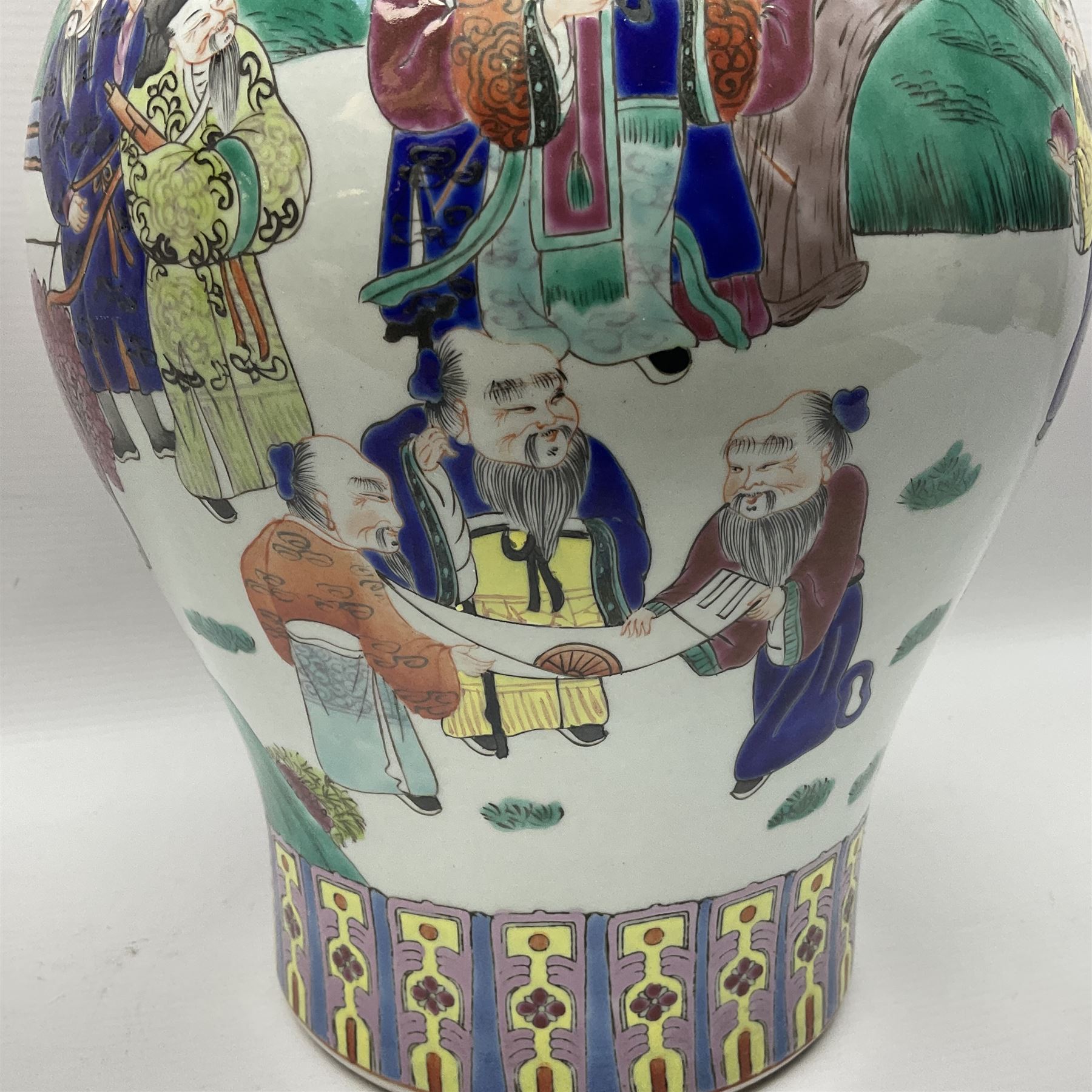 20th century Chinese Famille Rose vase, of baluster form with flared lobed rim and twin figural handles, decorated in polychrome enamel with figures dancing and playing instruments within a garden setting, H42cm
