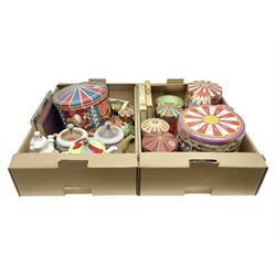Collection of circus and fairground collectables, to include teapots, biscuit tins, including musical examples, and four Circus/fair themed books, including two library first editions