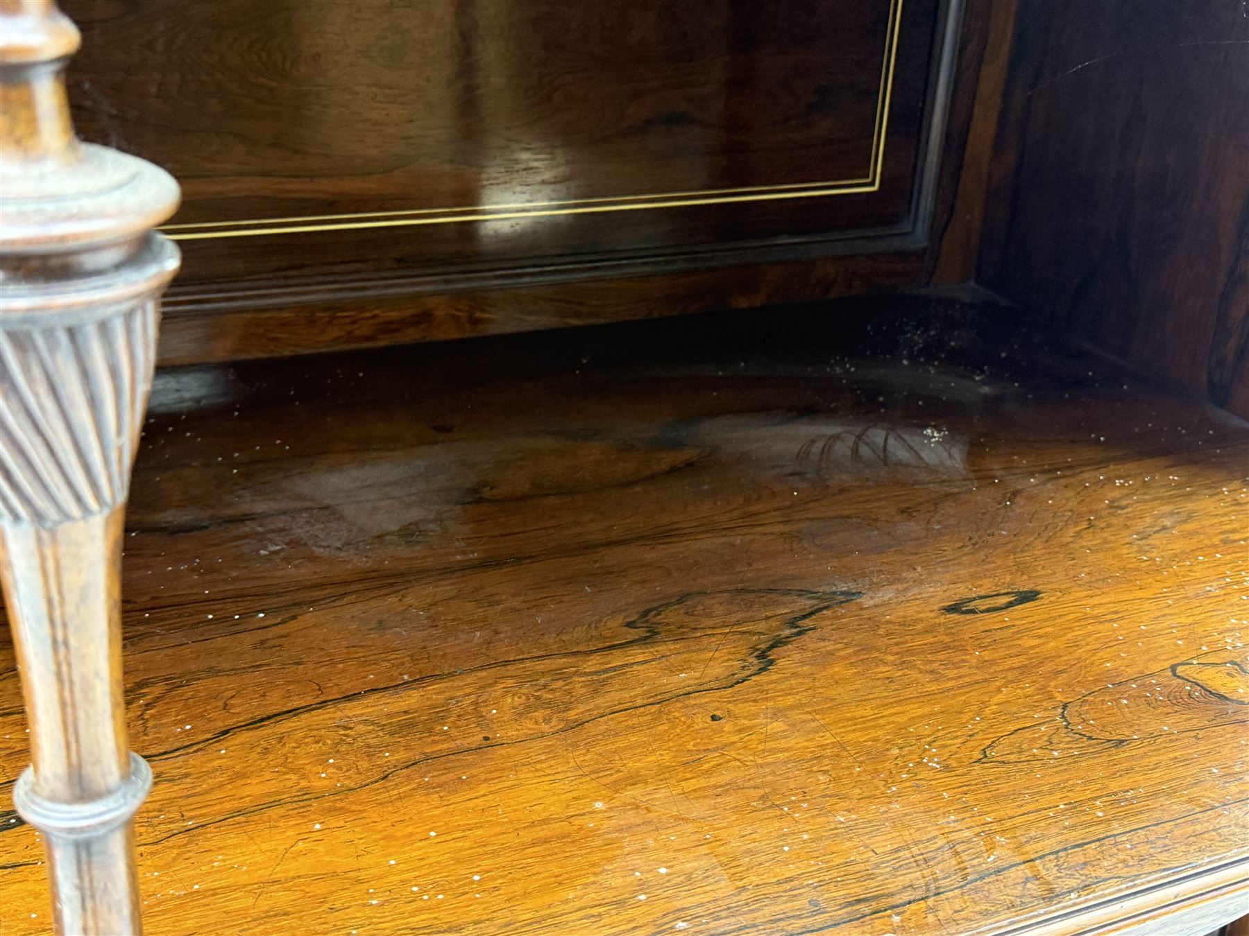 Victorian hardwood and inlaid display cabinet, central breakfront glazed display with astragal glazing and mirror back, flanked by mirrored alcoves with turned supports, below foliate and scrolling marquetry panels enclosing cupboard doors, shaped open shelves with turned supports beneath, on tapered and spade feet