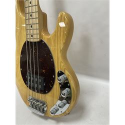 Ernie Ball Music Man Sting Ray 4 string bass guitar, in natural finish with roasted maple neck and tortoiseshell effect scratch guard, serial no 87485, in black Music Man hard case, guitar L114cm
