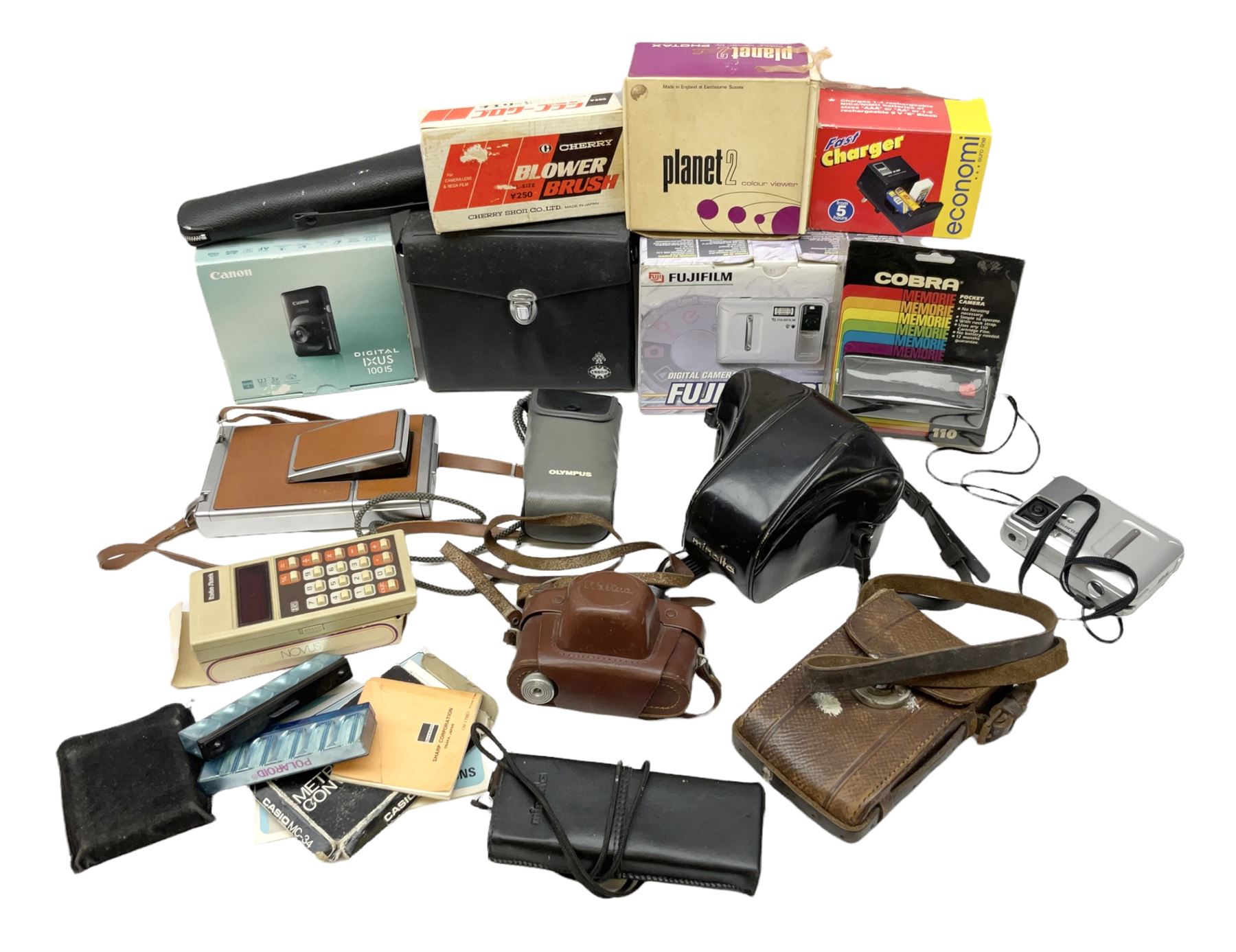 Minolta SRT101 camera, together with Halina camera, Fujifilm DX-8, Canon digital IXUS 1001S and other cameras and accessories 