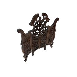Late 19th century carved mahogany fire screen, broken swan neck pediment with carved and pierced foliate and flower design, raised on scrolled supports