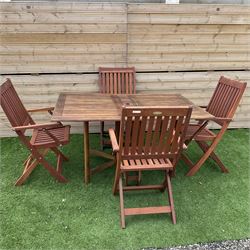 Winchester Collection - 20th century teak garden table drop-leaf table and set four matching folding chairs - THIS LOT IS TO BE COLLECTED BY APPOINTMENT FROM DUGGLEBY STORAGE, GREAT HILL, EASTFIELD, SCARBOROUGH, YO11 3TX