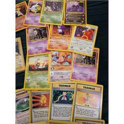 Collection of Pokemon TGC trading cards, including two WB First Movie Black Star promo cards Pikachu no. 4 and Dragonite no. 5, two Ancient Mew Black Star holo promo cards, Gym Challenge Giovanni's Persian 8/132 holo and a small collection WOTC, Neo Discovery and Neo Genesis cards, together with thirty four Bandai Carddass Pokemon cards, including prism Charizard no. 186 and Pokemon Topps cards including holo examples 