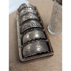 Six silver napkin rings, together with a silver topped cut glass jar, all hallmarked