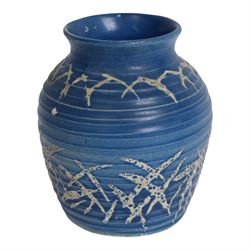 Quentin Bell 1910-1996: ribbed vase with fluted rim, decorated in white abstract design on a blue ground, signed Bell beneath, H16cm 