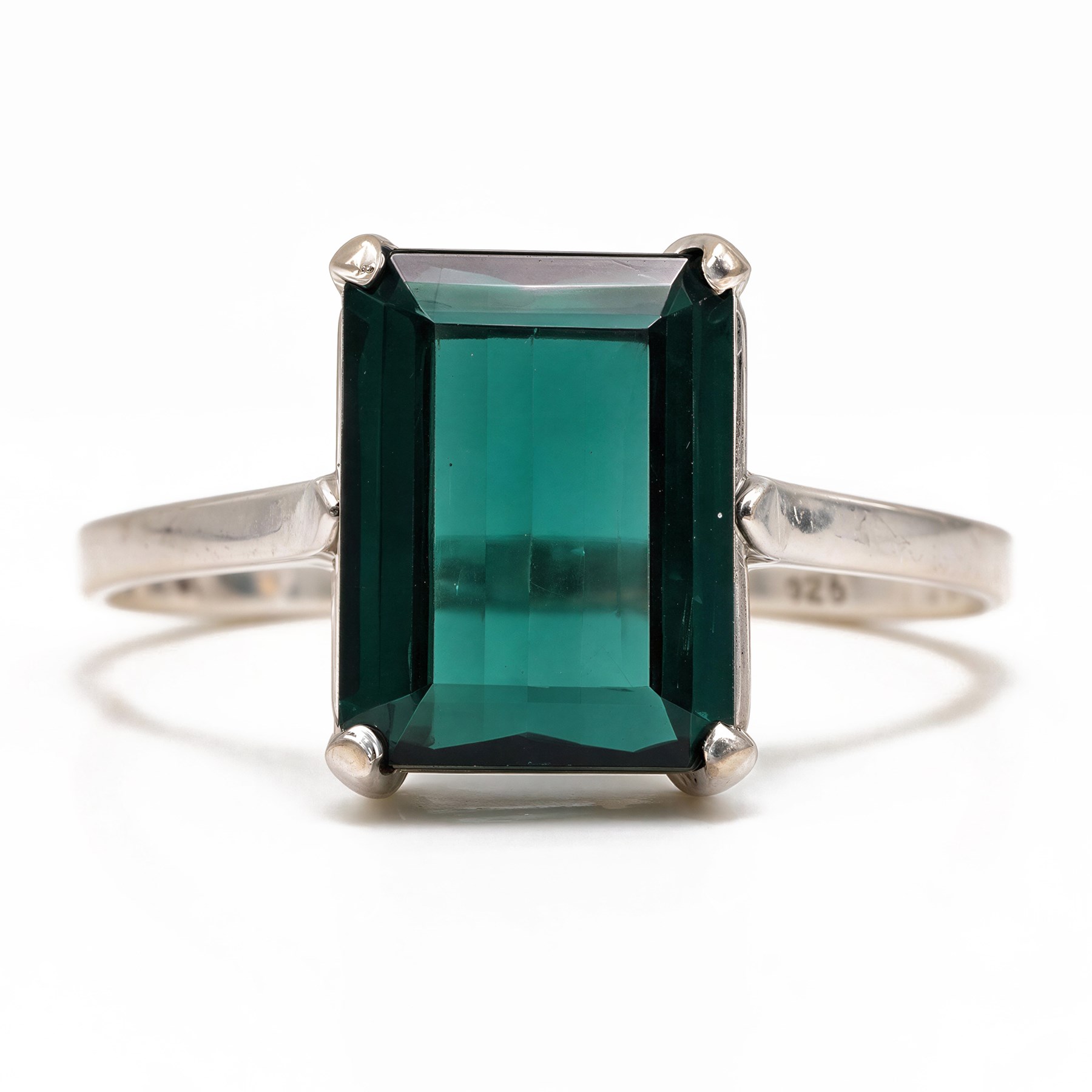 18ct white gold tourmaline ring, four claw set with an emerald cut green tourmaline of approx 6.95 carat, stamped 750