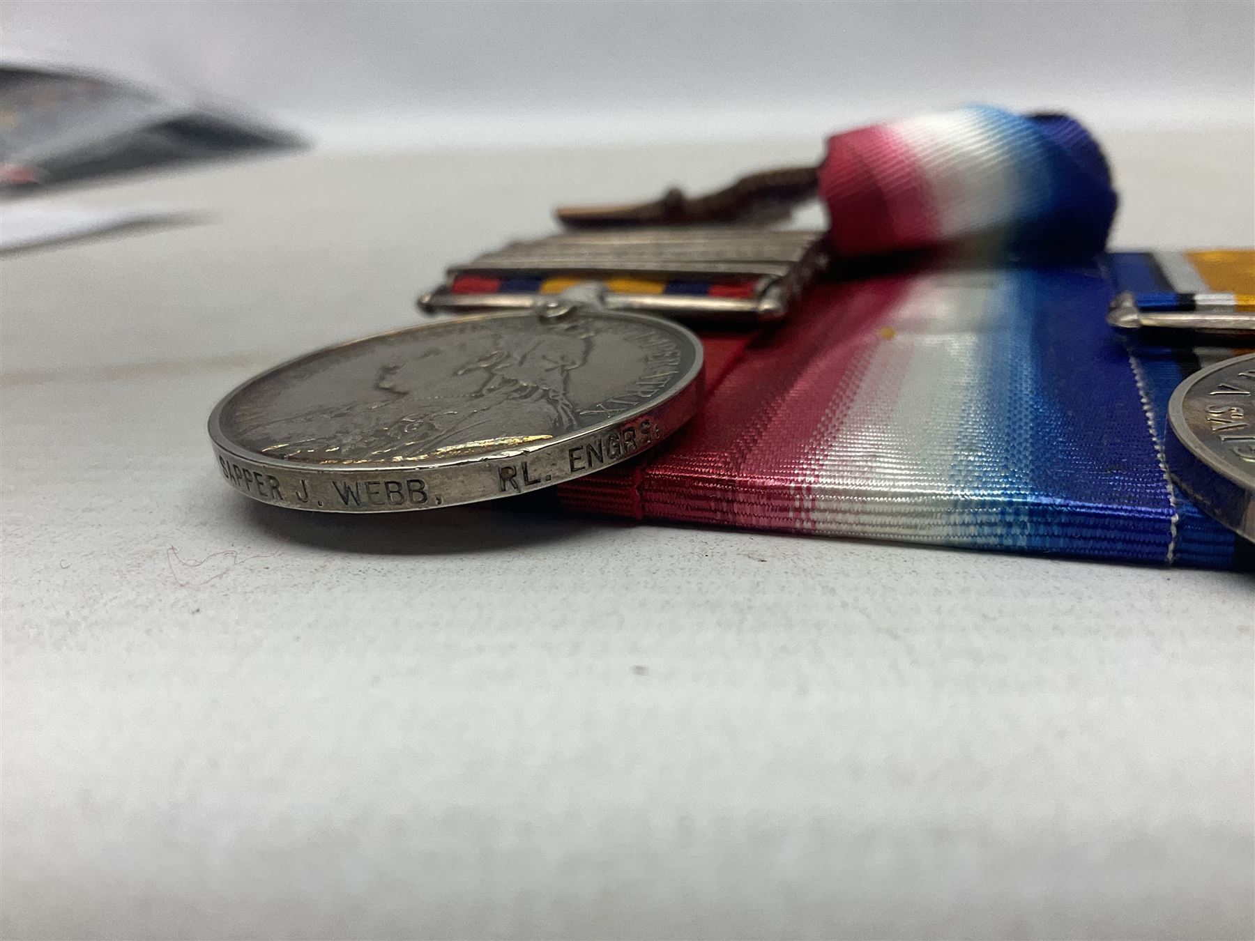 Boer War/WW1 group of four medals comprising Queens South Africa Medal with five clasps for South Africa 1901 & 1902, Transvaal. Orange Free State and Cape Colony awarded to 8321 Sapper J. Webb Rl. Engrs.; together with British War Medal, 1914-15 Star and Victory Medal awarded to 46989 2.Cpl. J. Webb R.E.; all with ribbons and mounted for display on card; some biographical details