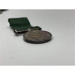 Victoria Volunteer Officers’ Decoration, V.R. cypher, hallmarked silver London 1892, with integral top riband bar and ribbon, unnamed; the matching miniature; and Victoria 'For Long Service in the Volunteer Force' miniature medal with ribbon in original case (3)