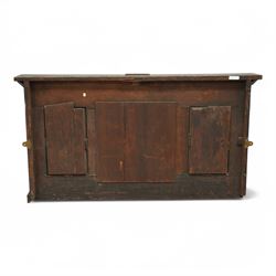 Victorian heavily carved oak wall mirror, lunette and foliage carved frieze over central bevelled mirror and flanking panels carved with floral urns, the upright frame decorated with geometric pattern chip carvings, lunette carved lower rail 