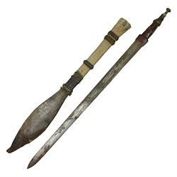 African Mandingo sword, the 75cm triple fullered blade with leather covered grip and brass pommel, in part leather covered scabbard with leaf shaped point L98cm overall