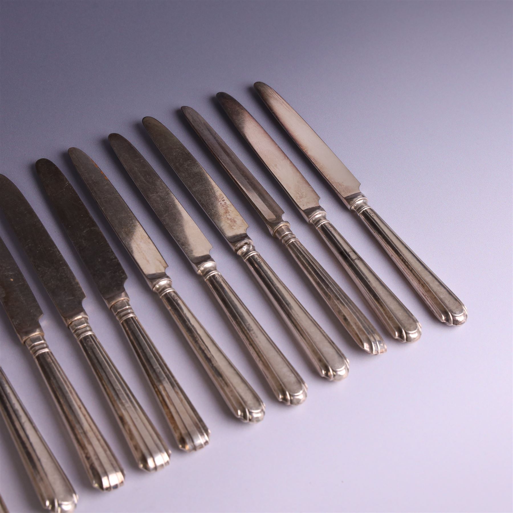 Set of twelve 1920s silver handled dessert knives and forks, hallmarked Thomas Bradbury & Sons Ltd, Sheffield 1921
