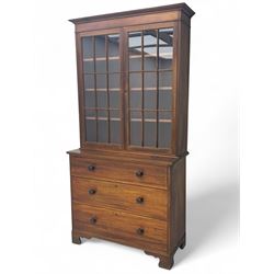 Late 19th century mahogany bookcase on chest, projecting moulded cornice over twin astragal glazed doors enclosing three shelves, base fitted with three graduated drawers, raised on shaped bracket supports