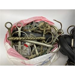 Collection of horse tack and equipment, including two cart harnesses, long reigns, bridles with blinkers, rains, bits, headcollars (size pony), whips etc, together with books relating to horses
