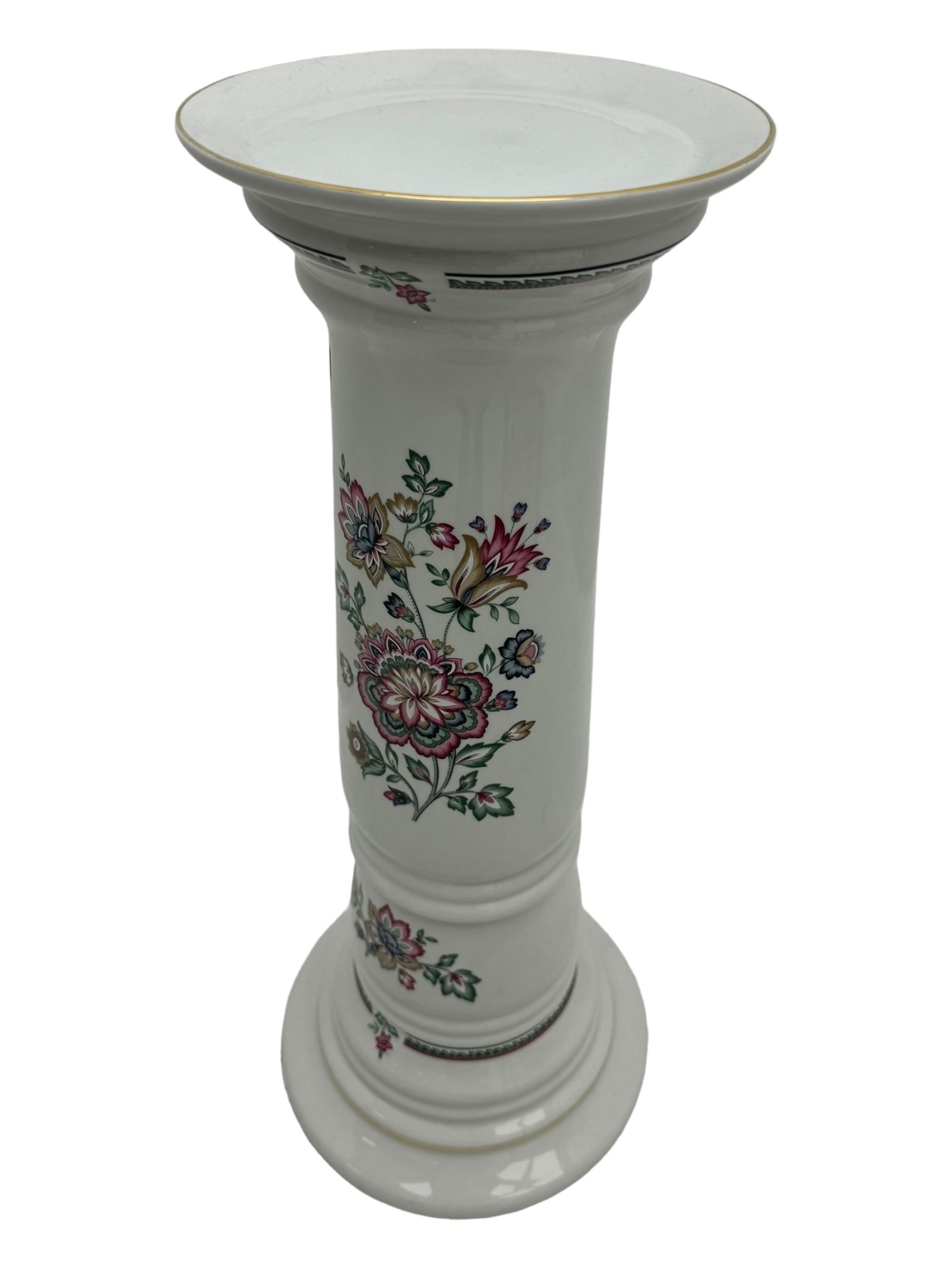 Royal Winton - early 20th century ceramic jardinière on stand, white ground with polychrome floral decoration, flared rim and twin handles, on circular base