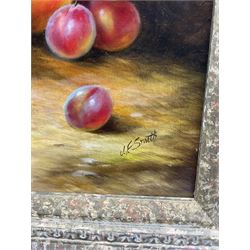 John F Smith (British 1934-): Still Life with Grapes and Peaches, oil on board signed 39cm x 29cm