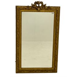 Gilt framed wall mirror, scrolled foliate cartouche pediment over frame decorated with foliage, plain mirror plate