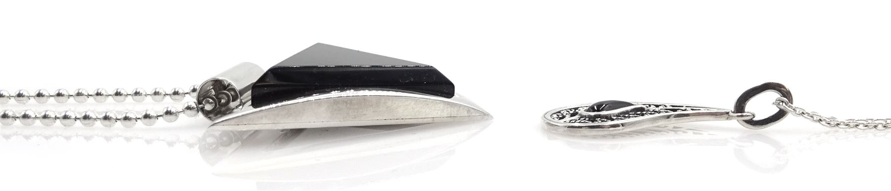 Silver contemporary triangular Whitby jet pendant necklace, two other silver Whitby jet necklaces; one round and one in a paisley shape, and two pairs of Whitby jet earrings; matching paisley shape and the other pair cushion triangle shaped, all stamped 925