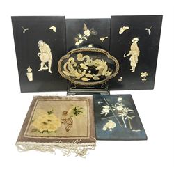 Set of four Chinese lacquered wall plaques, with applied decoration, depicting birds amongst peonies, together with a similar table screen, with mother of pearl dragon decoration and a small Oriental rug, decorated with a bird and peonies, with fringe edging, rug without fringe H33cm