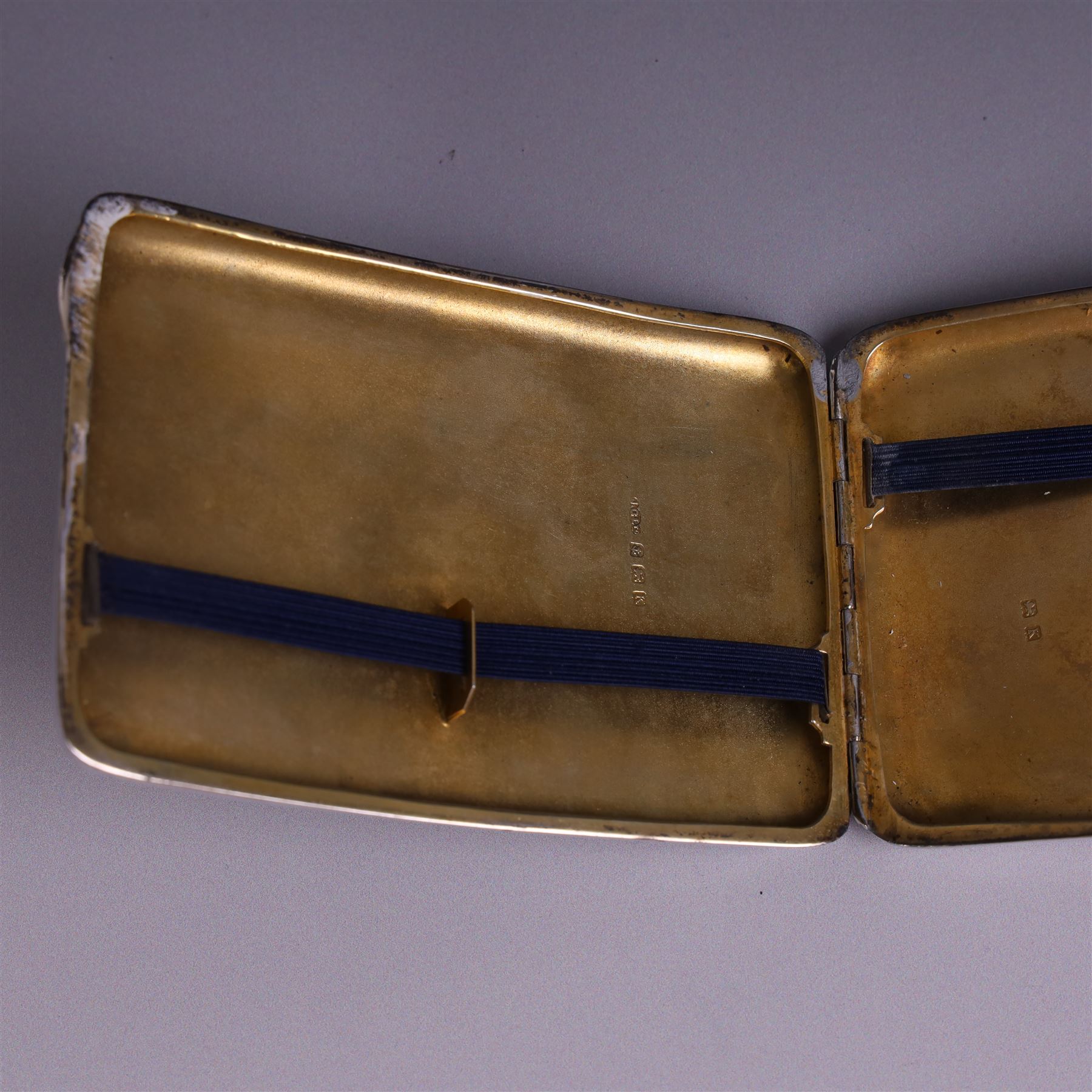 1930s silver cigarette case, of curved rectangular form with engine turned decoration and vacant cartouche, hallmarked Joseph Gloster Ltd, Birmingham 1934 and a 1930s silver sweetheart compact with engine turned decoration and enamel Royal Engineers crest, hallmarked Crisford & Norris Ltd, Birmingham 1939, cigarette box L12cm, H8cm
