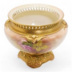 1920s Royal Worcester porcelain rose bowl, the flattened baluster body hand painted with roses and foliage, below a flared gilt pierced border, raised upon scroll moulded quatrefoil foot, shape no. H166, H13cm, together with a similarly decorated Royal Worcester bowl (2)